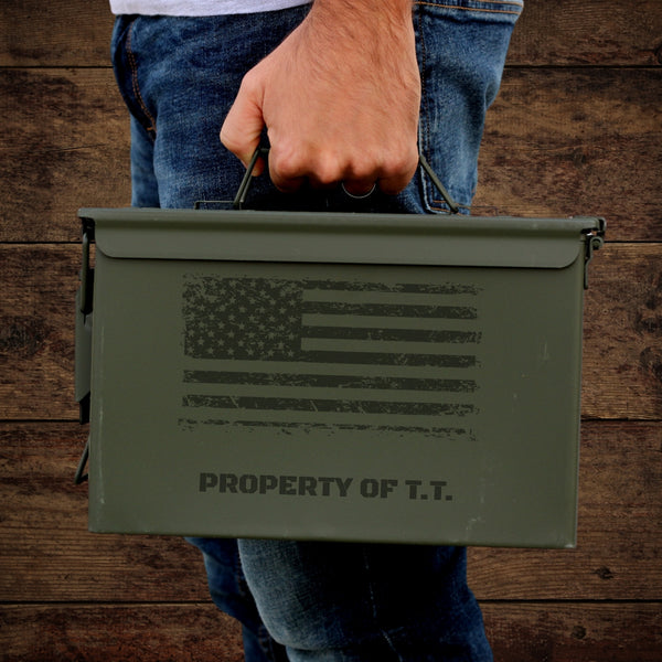 man holding engraved ammo can with American flag