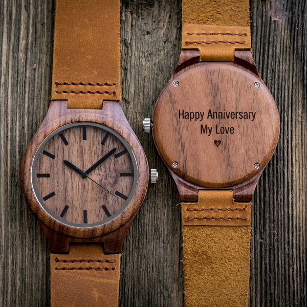 engraved wood watch on wood background