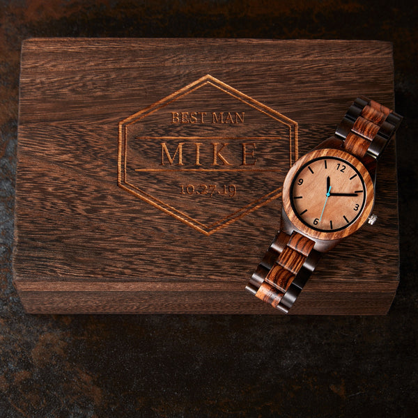 engraved gift box with wooden watch laying on top