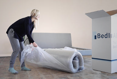 unpacking a mattress in a box