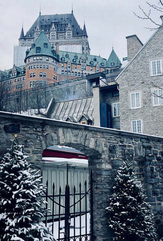 Beautiful architecture covered in snow on a foggy day in Quebec City