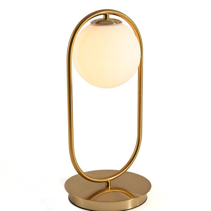 Lampe de chevet design en métal doré et boule en verre