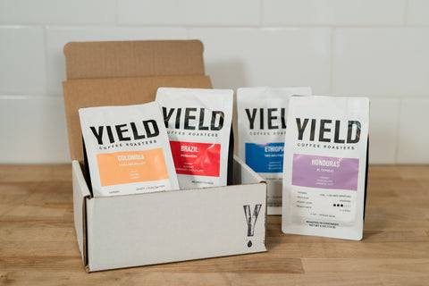 yield coffee bags in a sample box