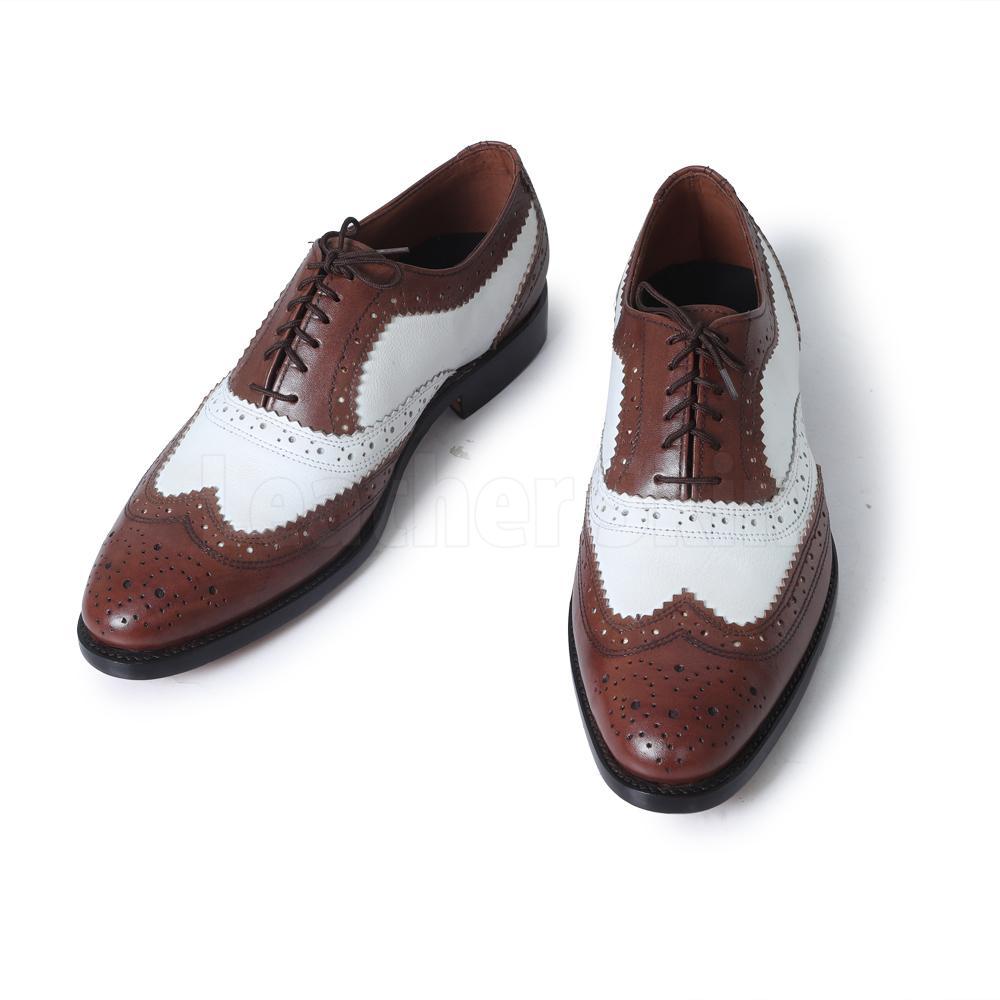 white and brown dress shoes
