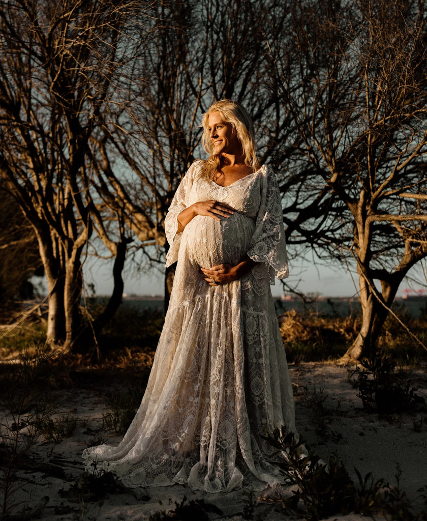 A beautiful pregnant lady wears Mama Rentals Reclamation Be Love gown in Nude Ivory at her maternity shoot.