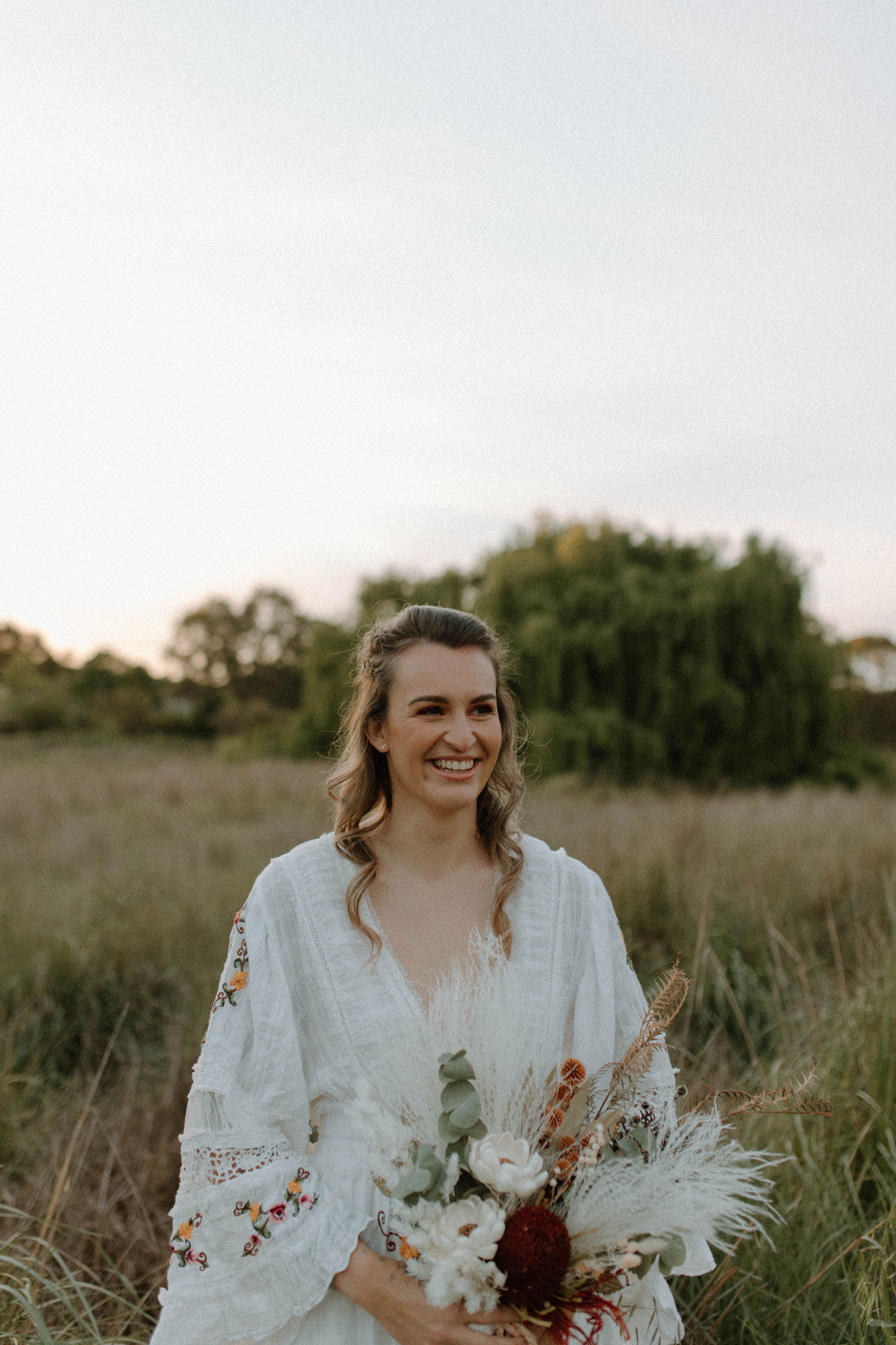 The beautiful bride wearing the Fillyboo Charm Your Way gown from Mama Rentals