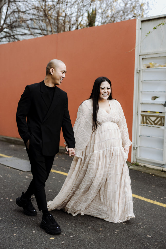 A beautiful non-pregnant lady wears Mama Rental's We Are Reclamation "Wonderment and Awe" gown at her wedding.