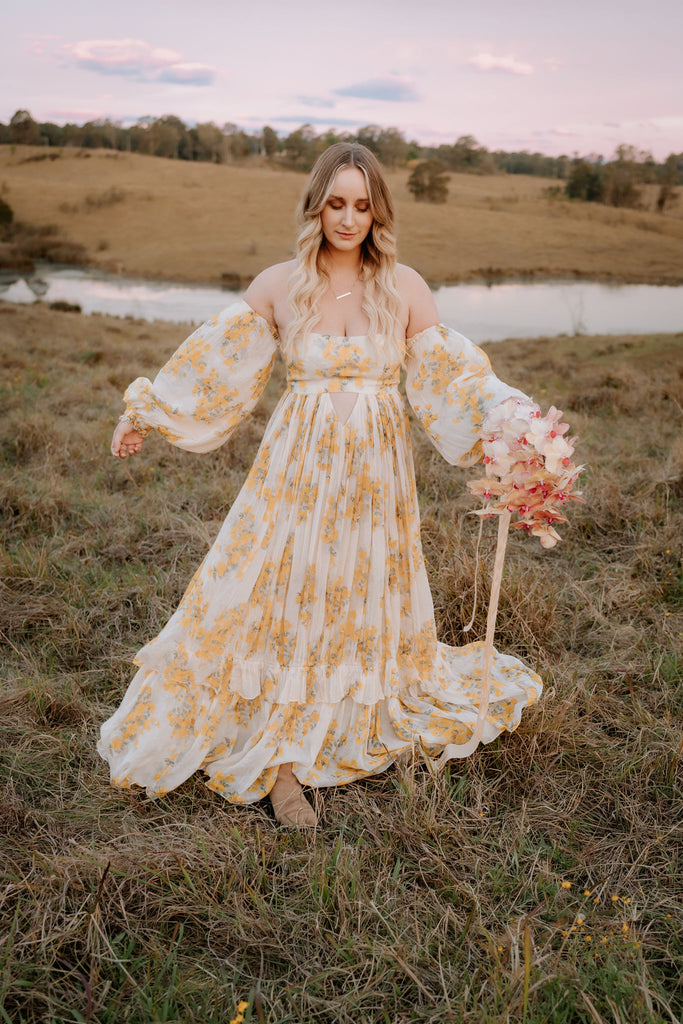 A beautiful non-pregnant lady wears Mama Rentals' Rooh Collective Poppy Zephyr Maxi Dress at her photo shoot.