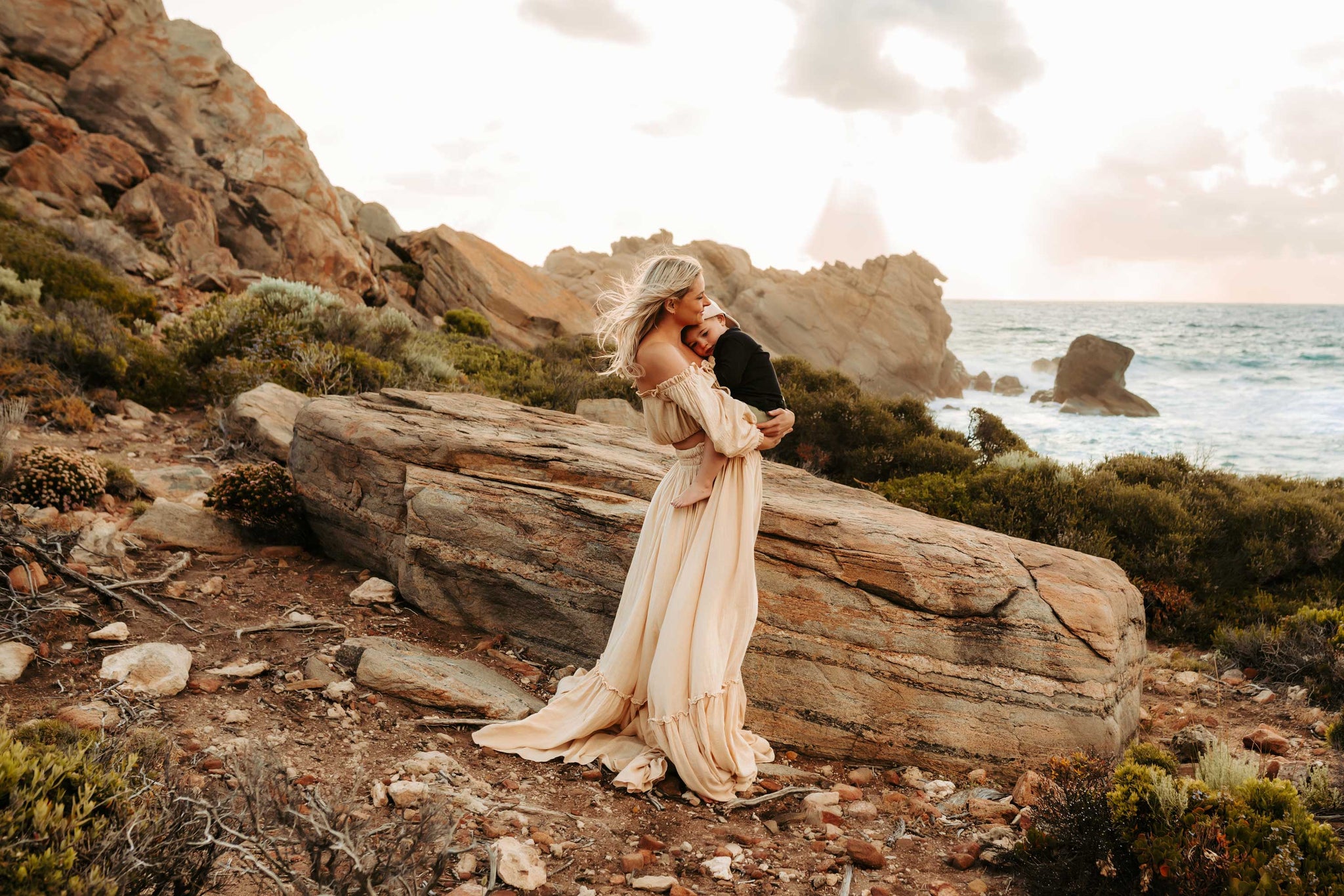 A beautiful non-pregnant lady wears Reclamation 'There’s Nothing Quite Like You' two piece Gown at her motherhood session.