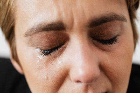 woman crying in pain exercise hurts