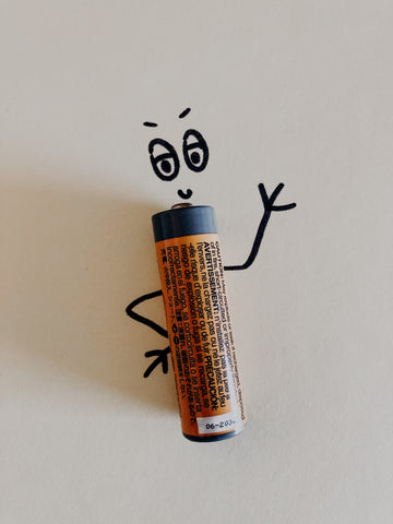 A person shaped like a battery as part of an illustration about natural solutions for fatigue.