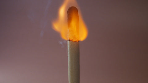lit match burning to represent vaginal dryness and irritation feeling