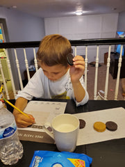 Kid scoring his Oreo on Oreo tasting score sheet {Daisy May & Me}