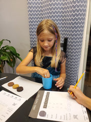 Kid dipping Oreo in glass of milk {Daisy May & Me}