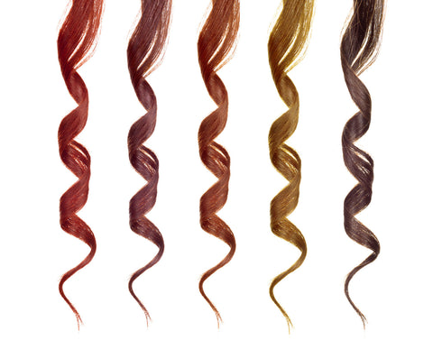 strands of different colored curly hair extensions