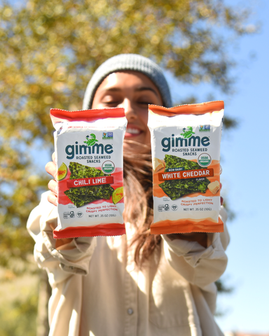Person holding Gimme Chili Lime + White Cheddar Roasted Seaweed Snacks