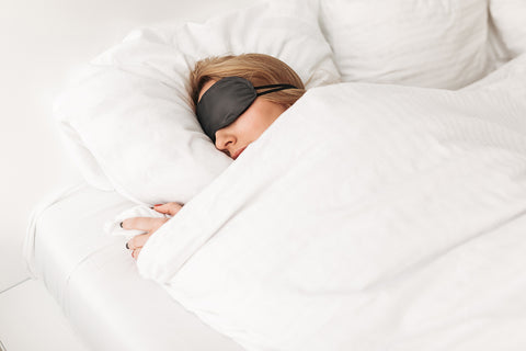 woman wearing eye mask to sleep