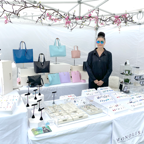 Picture of Artist Lisa Ramos as a vendor at a Festival  | Image is from Blog Article California Art & Wine Festivals, Fine Art Shows and Holiday Boutiques Events in 2024