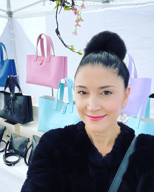 California Designer Lisa Ramos in her booth at an Art Show  - MONOLISA Handbags & Jewelry | Picture from The Art World - Getting Your Work into Art Shows Blog Article  