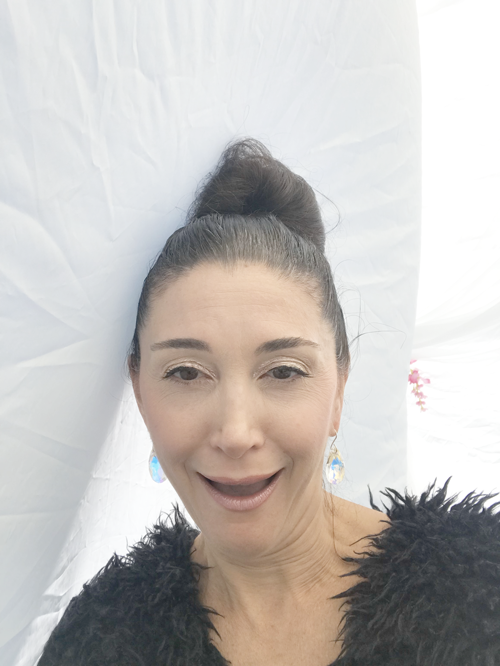 The Funny Side of Business - Selling at Art Shows & Festivals | Picture of Lisa Ramos Fighting The Wind and Laughing at the Strength of Mother Nature