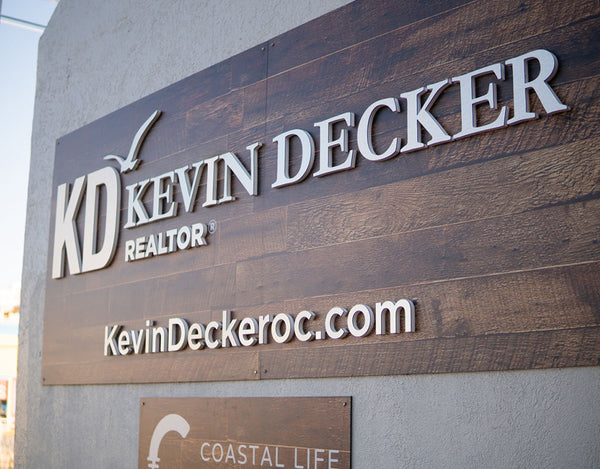sign for kevin decker of coastal life realty group in ocean city maryland