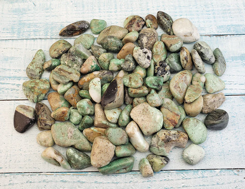 Collection of variscite stones on display.