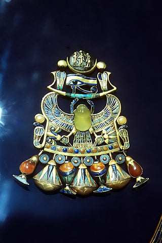 Image of Egyptian Tutankhamun Pectoral with winged scarab, eye of horus, and crescent moon