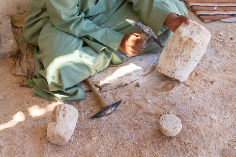 Someone chiseling away at stone - small scale mining