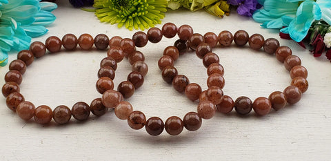 Raspberry red aventurine bracelets on display