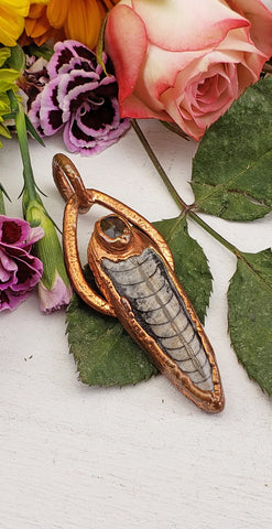 Copper pendant with fossil