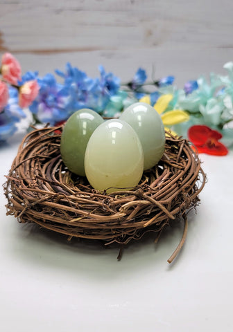 Serpentine subgroup stones carved into eggs. They are sitting in a prop nest