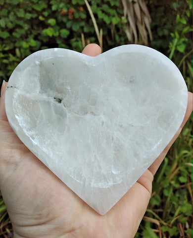 Selenite heart in hand