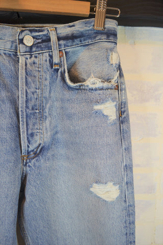 Closeup Destressed denim straight leg