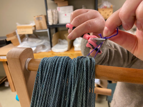 Skien of yarn being cut