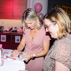 Image of Kristen signing a book