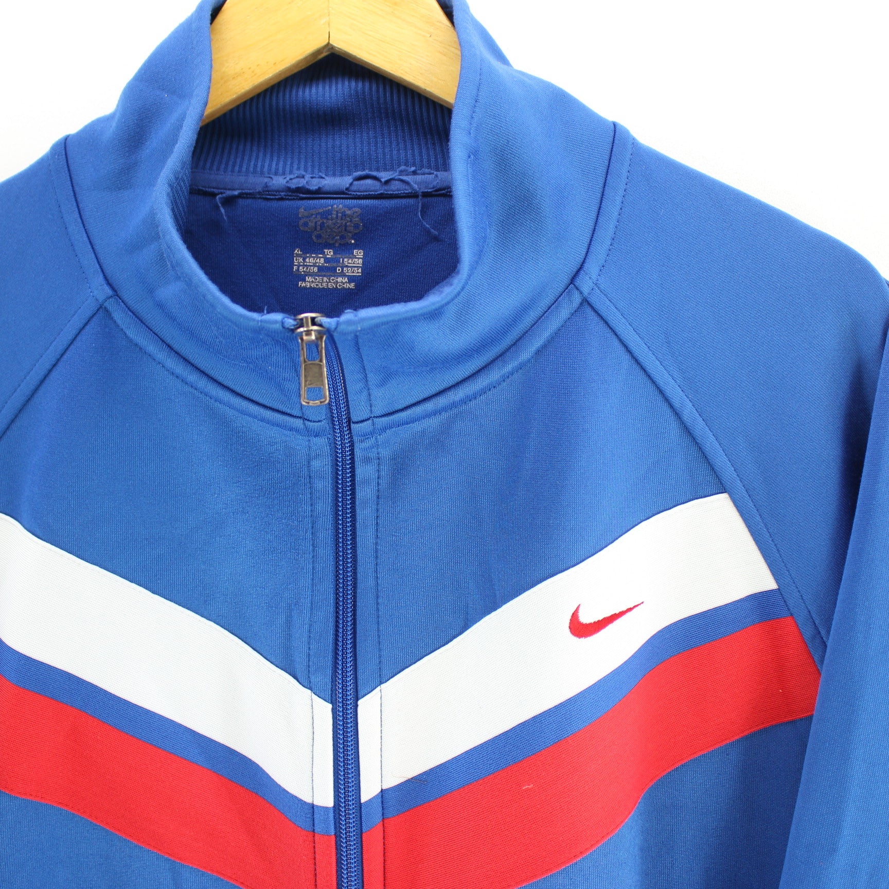 blue nike track top