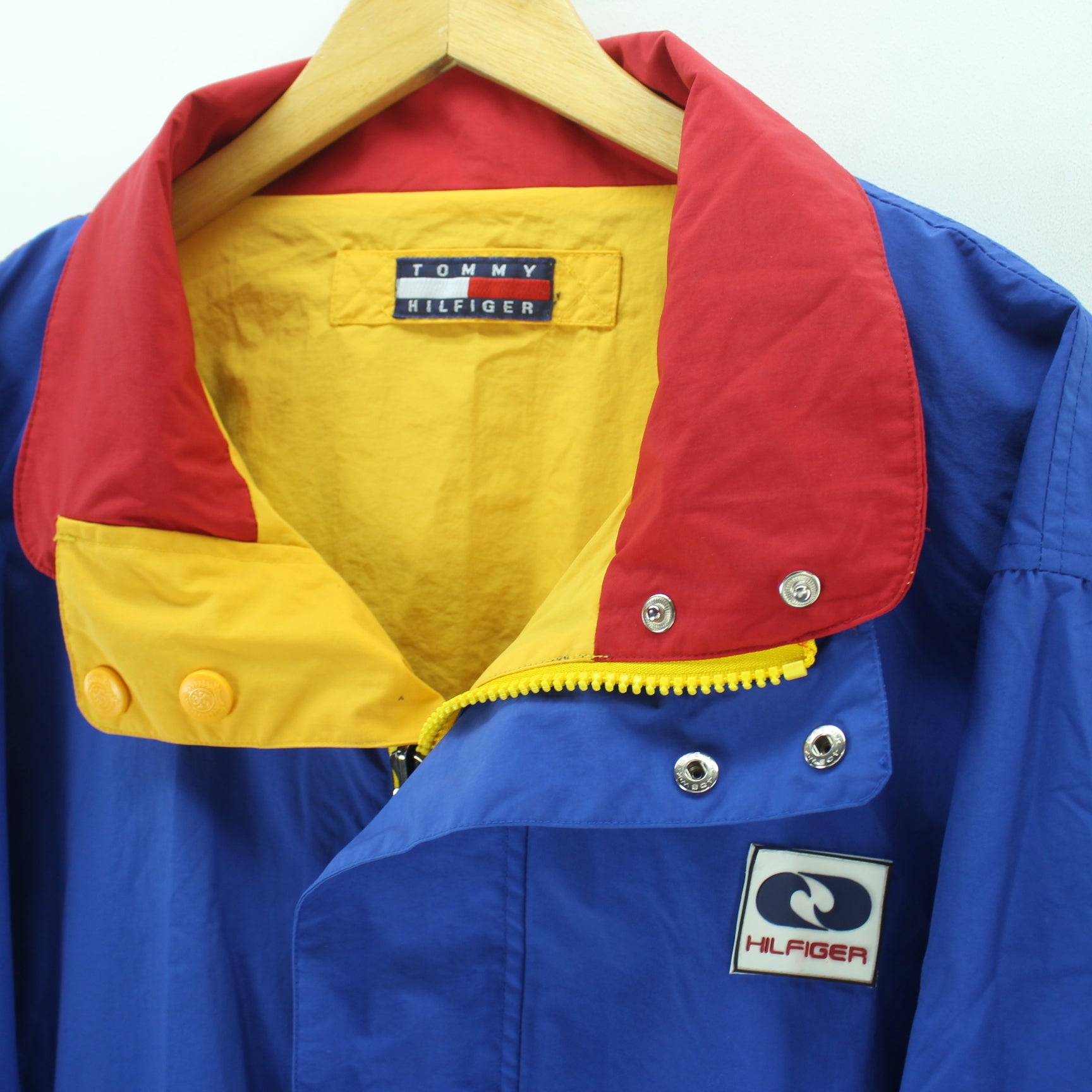 blue red and yellow tommy hilfiger jacket