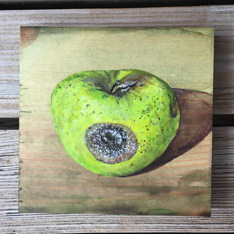 Rotting green apple