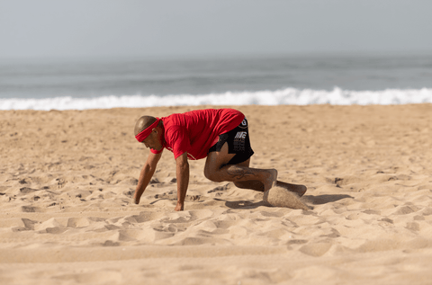 FightCamp Trainer Doing Bear Crawls on the Beach