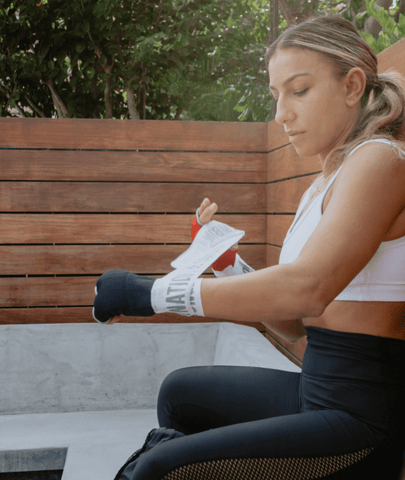 Female Putting On FightCamp Boxing Hand Wraps