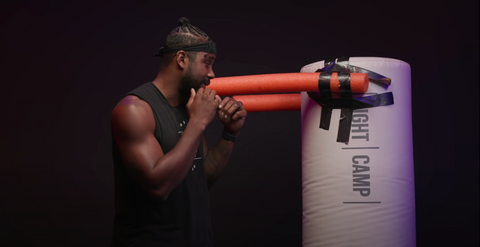 FightCamp Trainer Demonstrating a Boxing Drill Using DIY Equipment