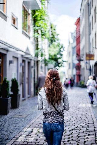 Woman Walking Alone In Street