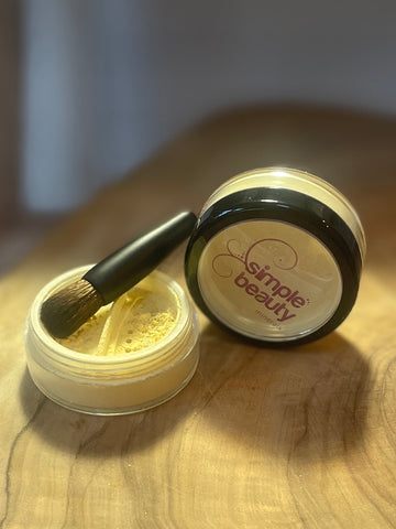 yellow mineral powder concealer open with mini brush.