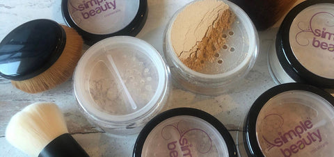 mineral foundation pots in a group some open some closed.