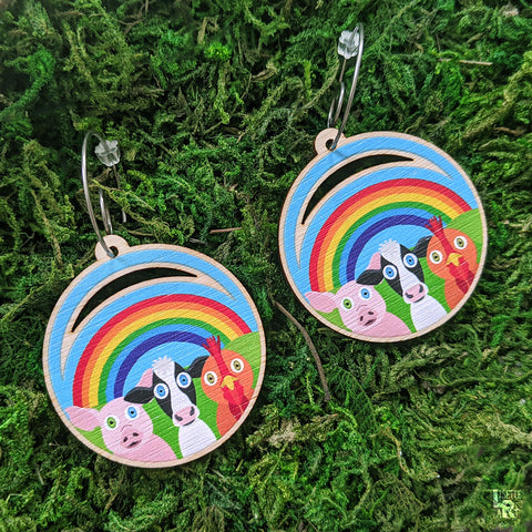 Cute animal earrings on moss