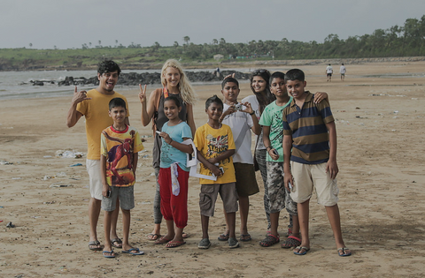 Emi Koch with her nonprofit Beyond the Surface International teaching kids to surf and about ocean protection