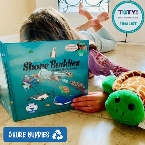 Kid reading Shore Buddies and the Plastic Ocean.png