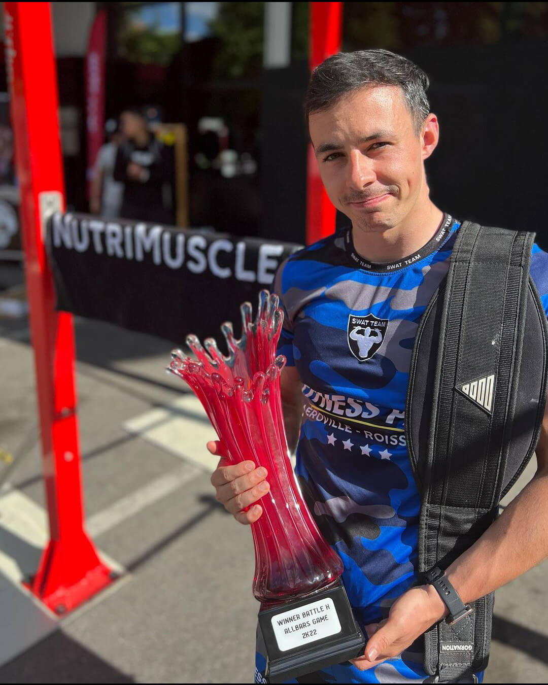 Street Workout athlete Florian Marrec holding winner trophy of allbars game