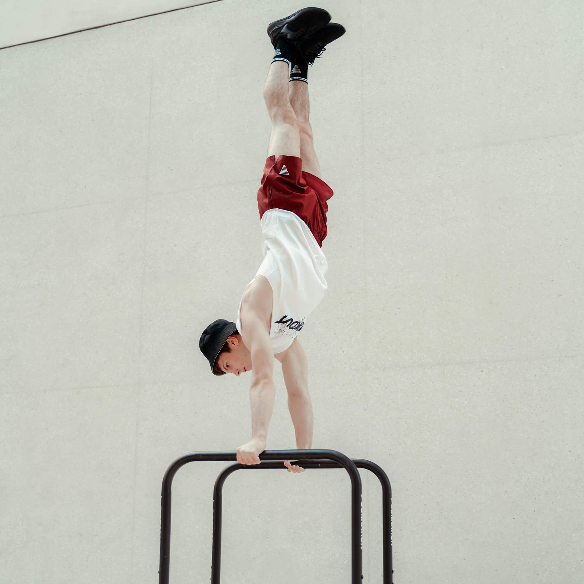 Exercise on dip bars high parallel bars handstand