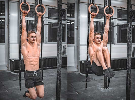 street workout athlete does knee raises on workout rings